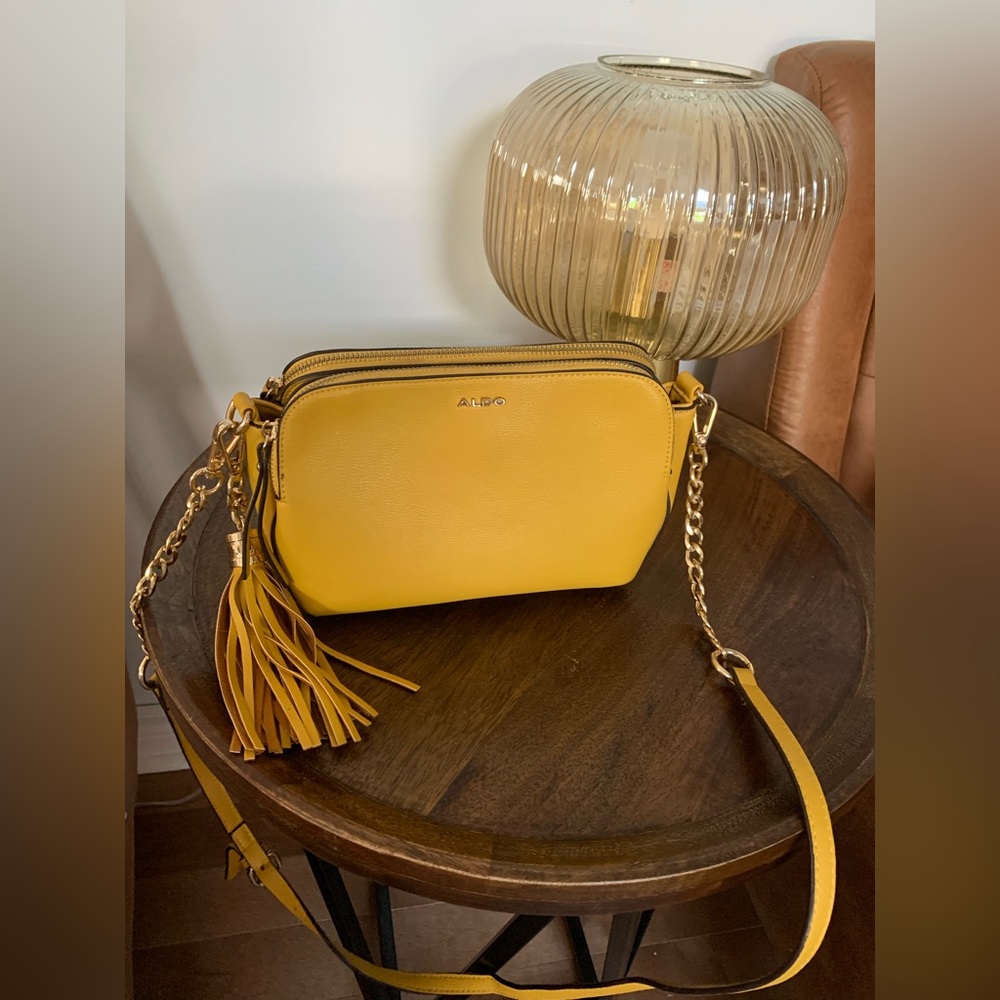 Like new Aldo crossbody - mustard coloured with 3 pockets, 2 are zippered.